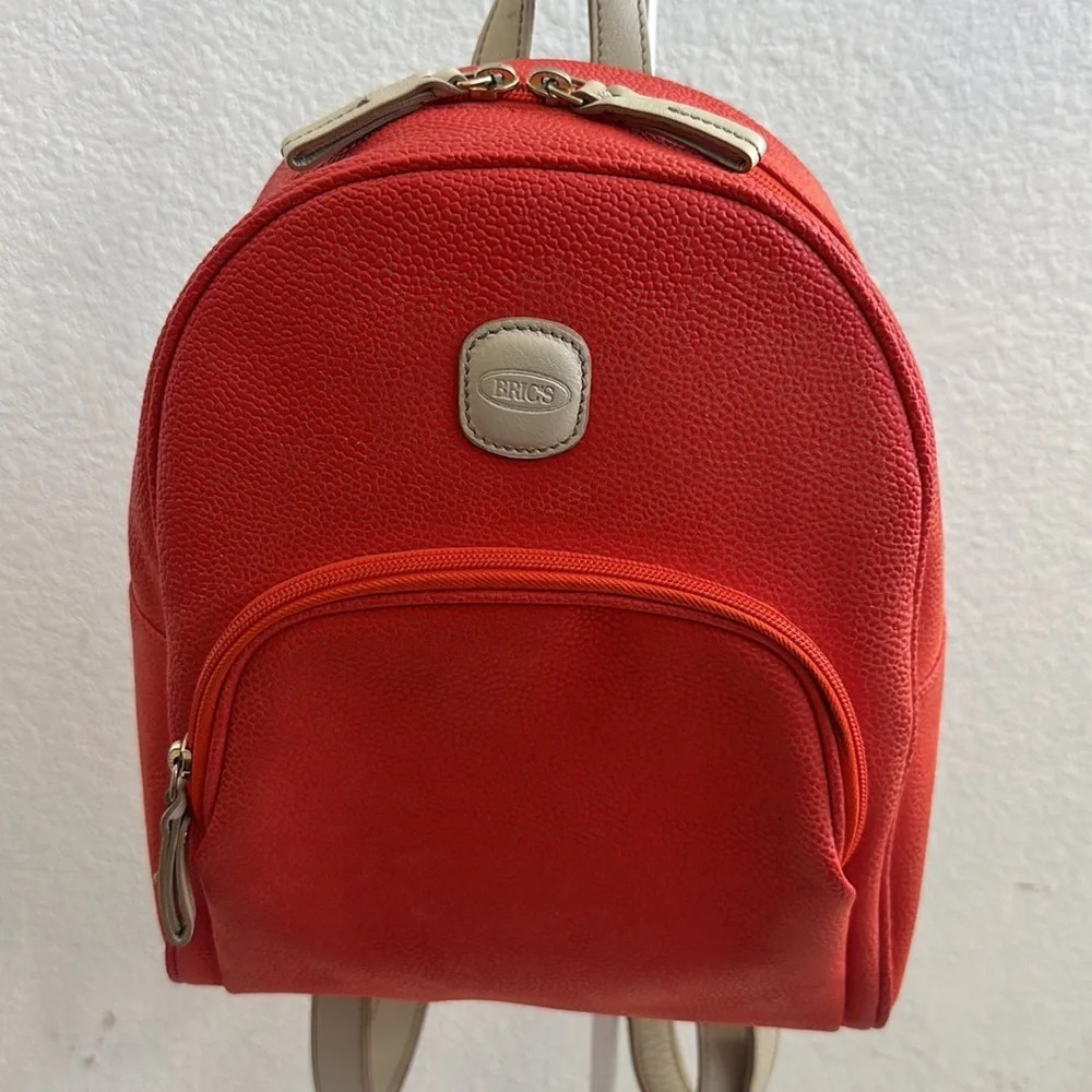 Orange leather with tan accents by Bric’s